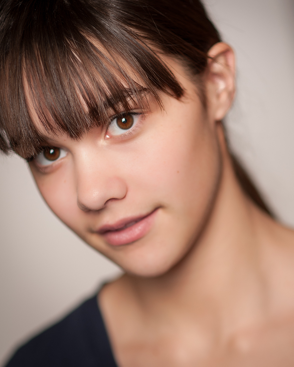 Man in NW Orthopedic Specialists navy polo with arms crossed, professional studio headshot, Spokane