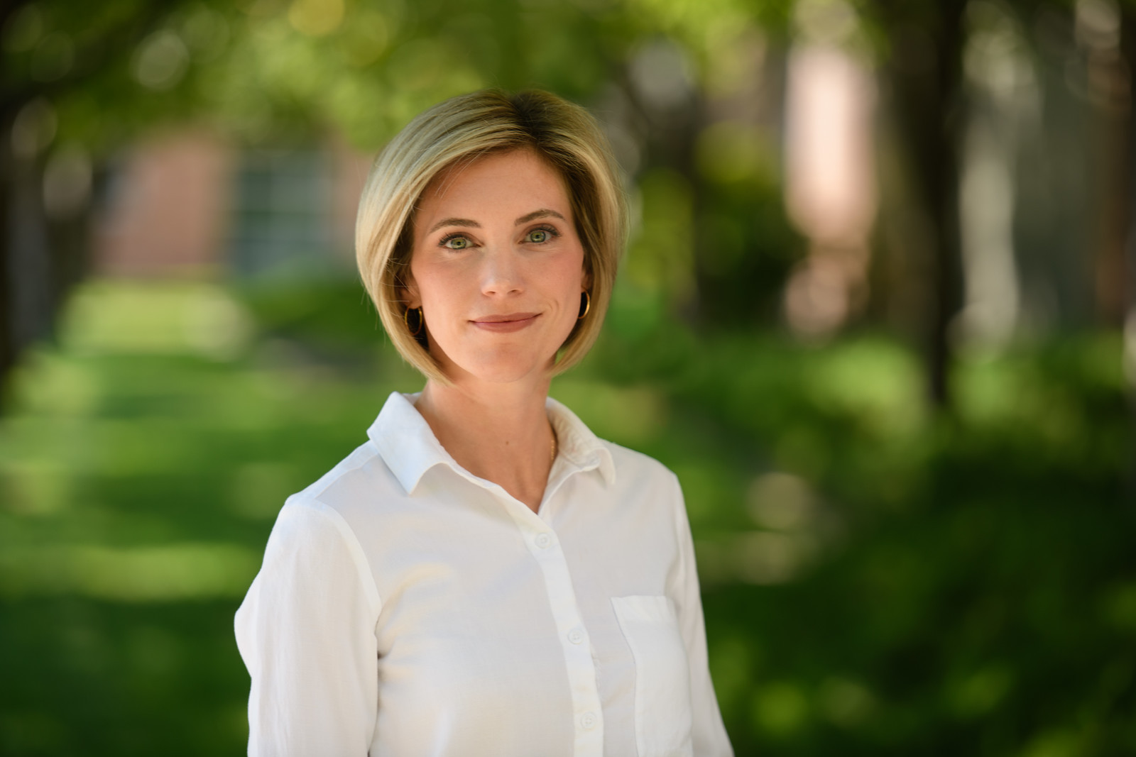 Close-up portrait of a young person with brown bangs and striking brown eyes, Spokane headshot photography