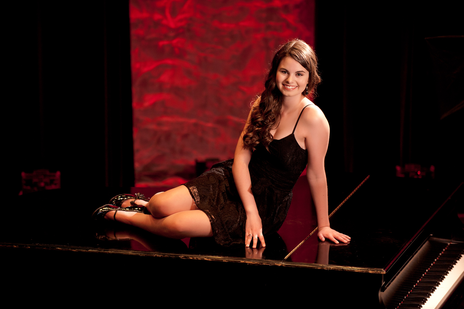 High school senior girl in white floral off-shoulder top on an urban staircase, Spokane senior portraits
